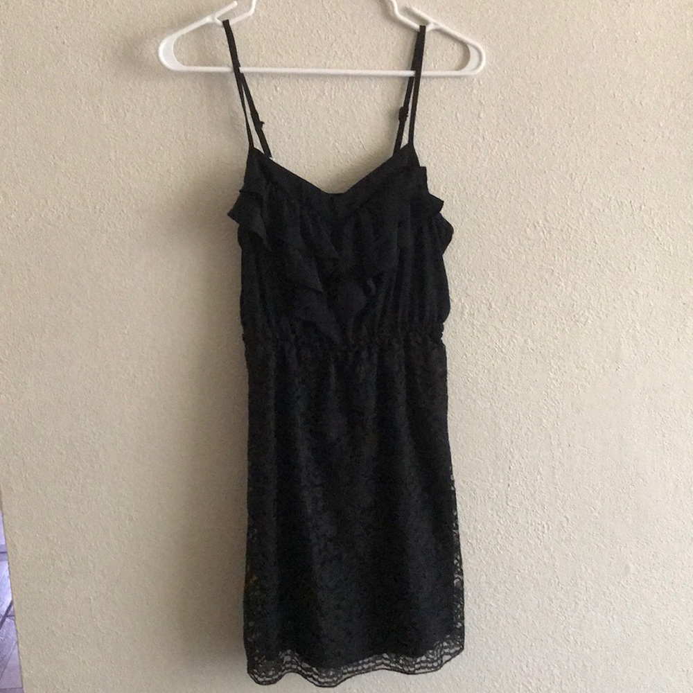 Slim black party dress.